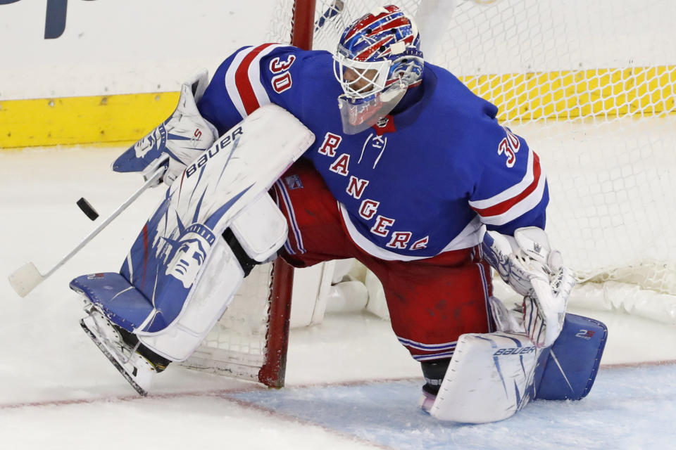 FILE - In this Dec. 27, 2019, file photo, New York Rangers goaltender Henrik Lundqvist makes a save during the third period of the team's NHL hockey against the Carolina Hurricanes in New York. Lundqvist signed with the Washington Capitals when free agency opened Friday, Oct. 9, 2020. (AP Photo/Kathy Willens, File)