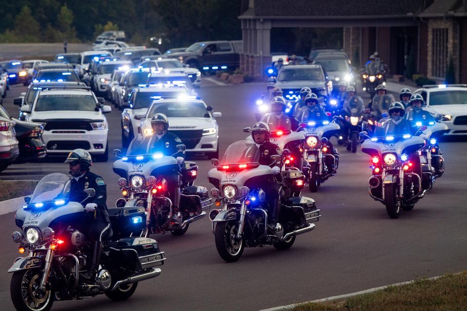 Hundreds of police officers leave Mynatt Funeral Home in Powell for a procession of honor.