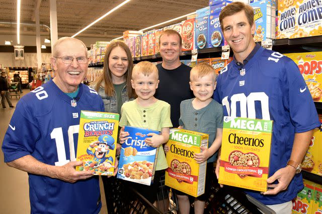 <p>Ken Alswang for the Jay Fund</p> Eli Manning and Coach Tom Coughlin