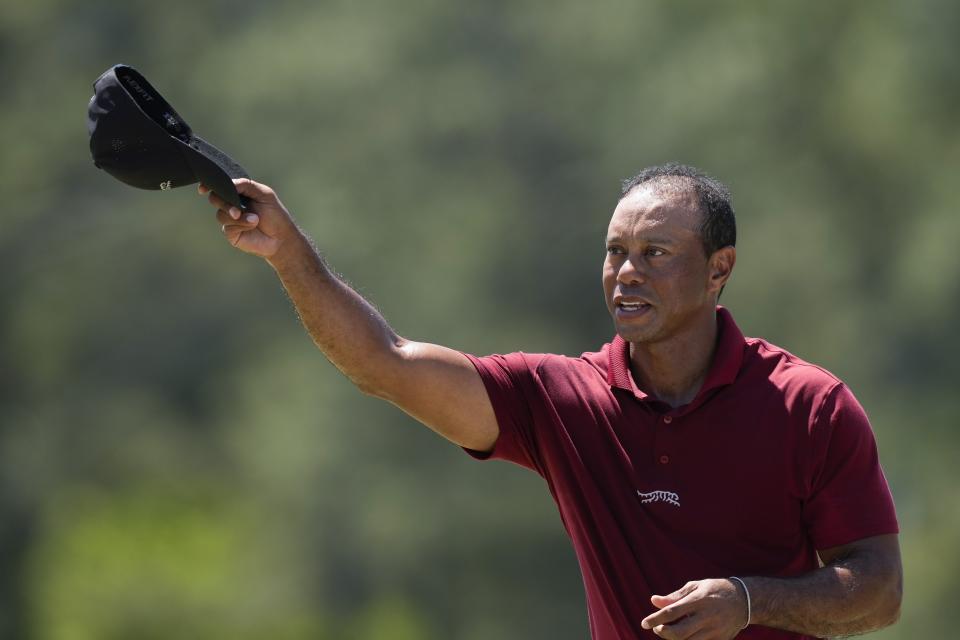 Tiger Woods waves after his final round at the Masters golf tournament at Augusta National Golf Club Sunday, April 14, 2024, in Augusta, Ga. (AP Photo/David J. Phillip)