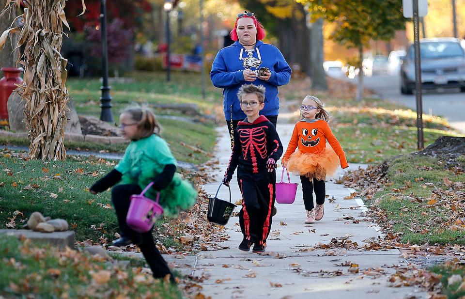 Railynn, Zayne and Harleen Hale trick or treat on Samaritan Avenue Thursday, Oct. 27, 2022. TOM E. PUSKAR/ASHLAND TIMES-GAZETTE