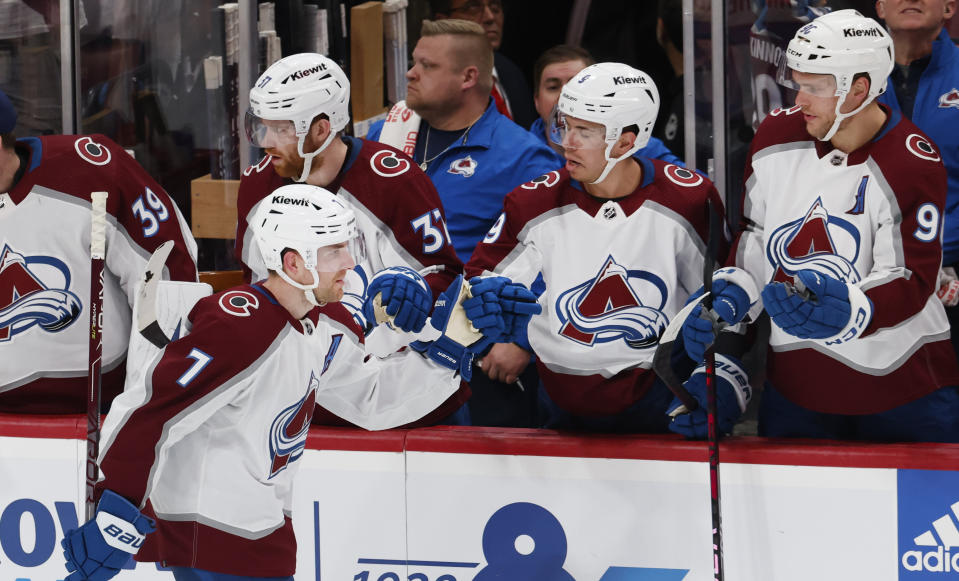 Colorado Avalanche defenseman Devon Toews (7) is congratulated for his goal against the Florida Panthers during the second period of an NHL hockey game Saturday, Feb. 11, 2023, in Sunrise, Fla. (AP Photo/Reinhold Matay)