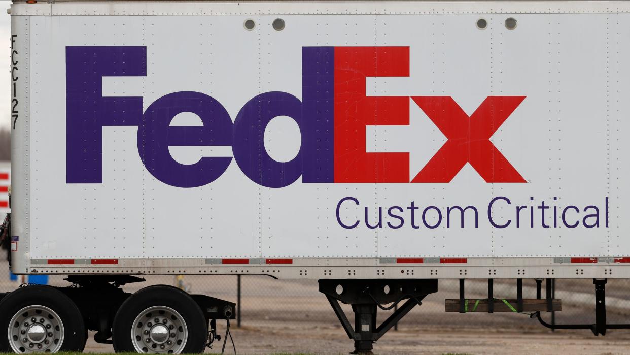 FILE - This April 1, 2020 file photo shows a FedEx logo at a facility in Romulus, Mich. Nearly two dozen FedEx packages have been found dumped in woods along a rural road in an Alabama town about 75 miles from a ravine where hundreds of undelivered FedEx parcels previously were discovered, police said Wednesday, Dec. 1, 2021. (AP Photo/Paul Sancya, file)