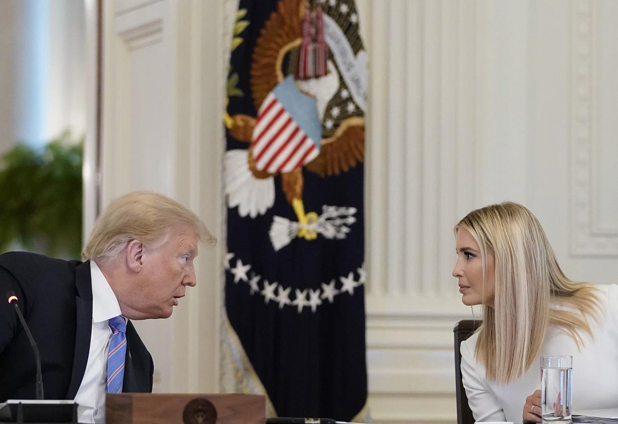 U.S. President Donald Trump (left) talks with White House advisor Ivanka Trump (right) during a meeting of the American Workforce Policy Advisory Board in the East Room of the White House on June 26, 2020 in Washington, DC. 