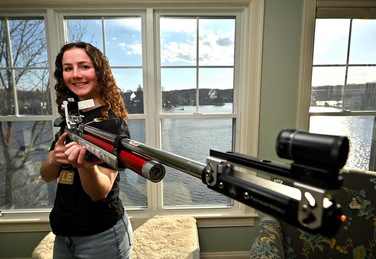 Shrewsbury's Barbara Forgues, a competitive markswoman from Shrewsbury and a senior at Marianapolis Prep, poses with one of the tools of her trade.