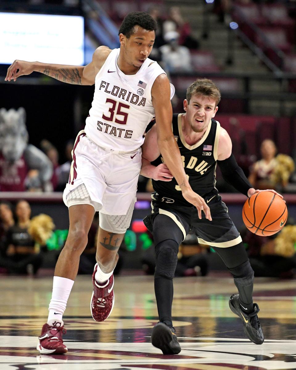 Nov 30, 2022; Tallahassee, Florida, USA; Purdue Boilermakers guard Braden Smith (3) is bumped by Florida State Seminoles guard Matthew Cleveland (35) during the first half at Donald L. Tucker Center. Mandatory Credit: Melina Myers-USA TODAY Sports