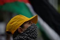 <p>A demonstrator holding her child attends a protest in front of the Consulate of the United States of America against U.S. President Donald Trumps announcement to recognize Jerusalem as the capital of Israel and plans to relocate the U.S. Embassy from Tel Aviv to Jerusalem, on December 12, 2017 in Rio de Janeiro, Brazil. (Photo by Fabio Teixeira/Anadolu Agency/Getty Images) </p>