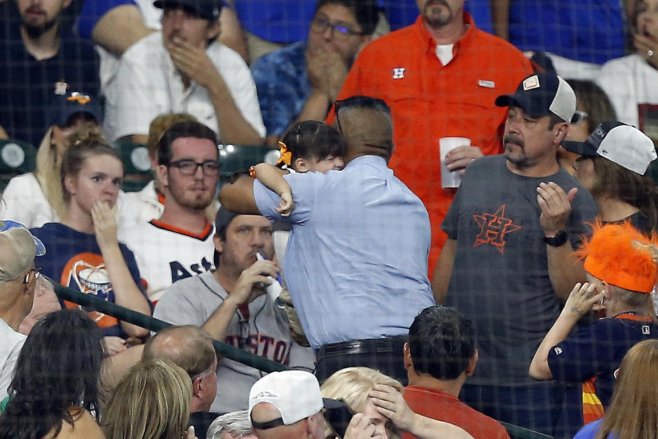 HOUSTON, TEXAS - MAY 29: A young child is rushed from the stands after being hit by a hard foul ball off the bat of Albert Almora Jr. #5 of the Chicago Cubs in the fourth inning against the Houston Astros at Minute Maid Park on May 29, 2019 in Houston, Texas. (Photo by Bob Levey/Getty Images)