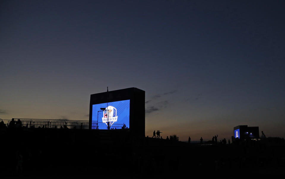 The sun rises as spectators arrive on the course for the fourball matches on the opening day of the 42nd Ryder Cup at Le Golf National in Saint-Quentin-en-Yvelines, outside Paris, France, Friday, Sept. 28, 2018. (AP Photo/Alastair Grant)