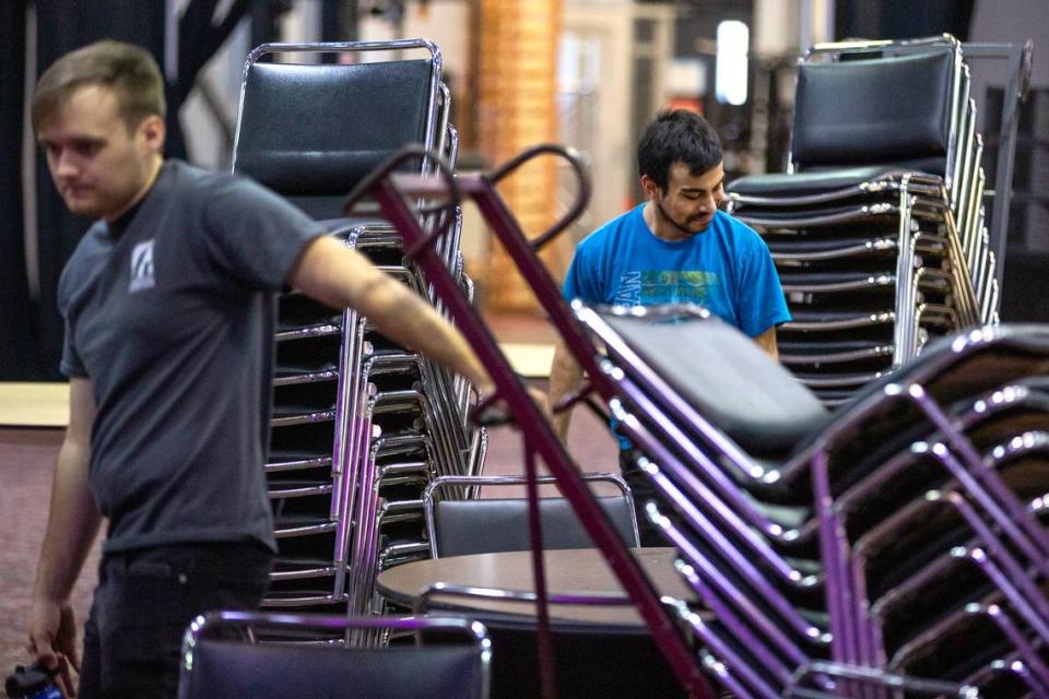 Alongside other members of the crew, Joseph Sanchez, 18, left, sets up chairs in preparation for an upcoming event on Tuesday, Nov. 14, 2023, at the Gateway Convention Center in Collinsville, Ill. Sanchez is a senior at Collinsville High School and a part of an apprenticeship program for students with disabilities. Tristen Rouse/Tristen Rouse
