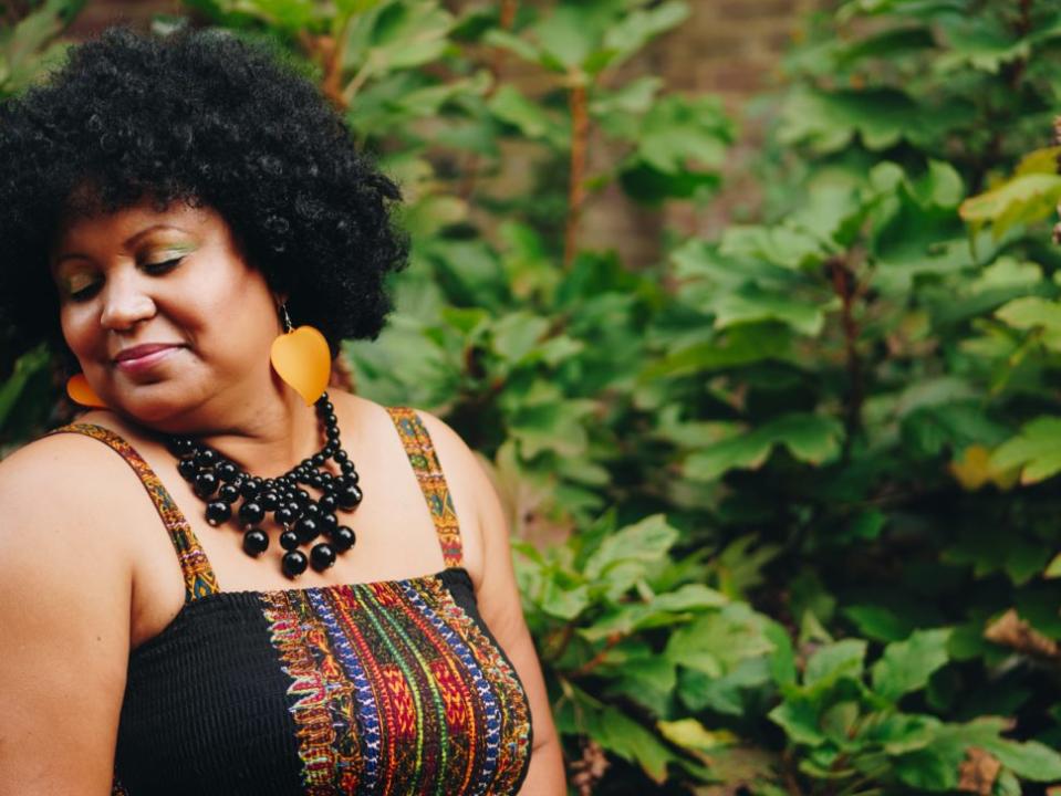 black woman with natural hair and jewelry