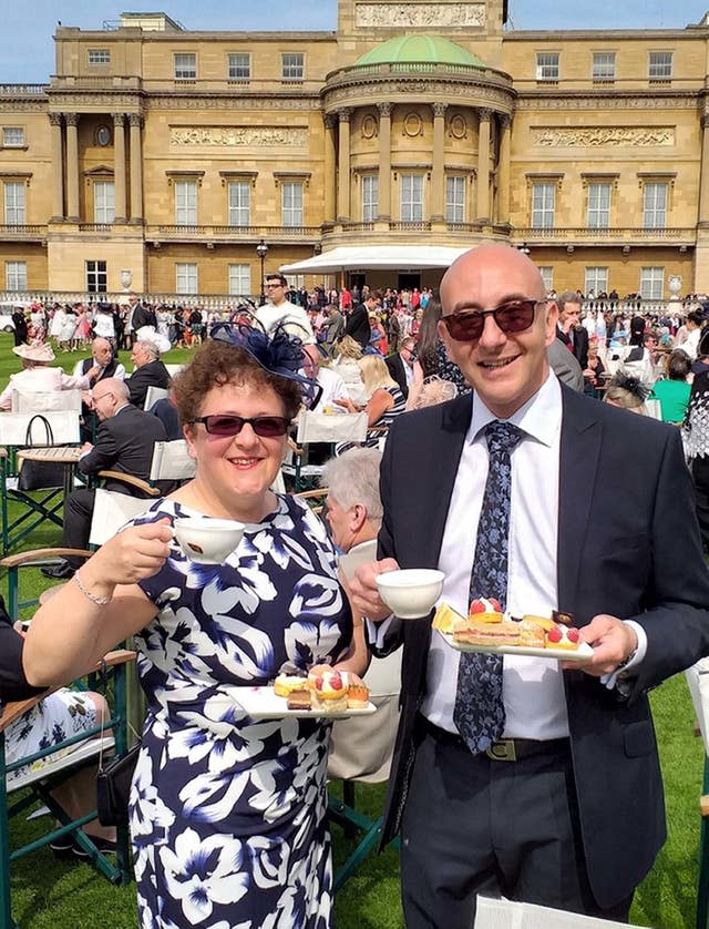 Michelle Beaver with her husband Peter during a garden party at Buckingham Palace in London