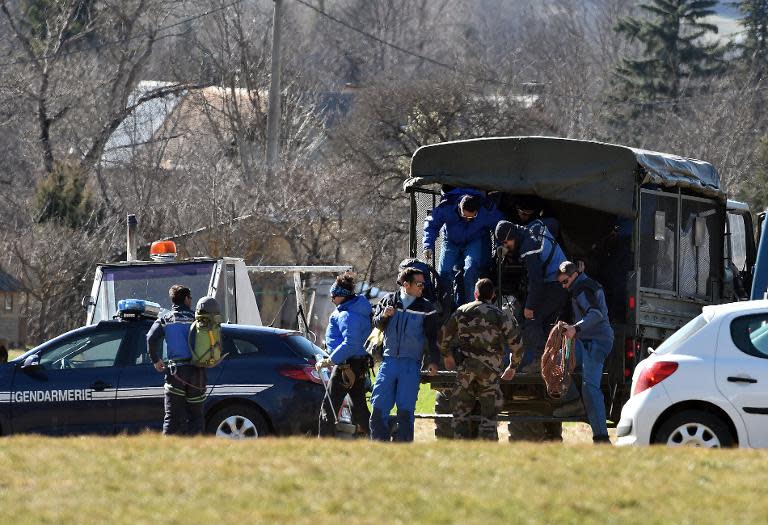 French gendarmes get off a truck on April 1, 2015 in Seyne-les-Alpes after working at the crash site of the Germanwings Airbus A320