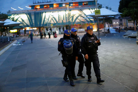 Police officers patrol tourist plaza Garibaldi hours after unknown assailants attacked people with rifles and pistols at an intersection on the edge of the plaza in Mexico City, Mexico September 15, 2018. REUTERS/Gustavo Graf