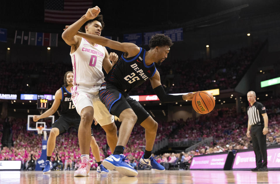 DePaul's Jeremiah Oden (25) is defended by Creighton's Jasen Green (0) during the first half of an NCAA college basketball game Saturday, Jan. 27, 2024, in Omaha, Neb. (AP Photo/Rebecca S. Gratz)