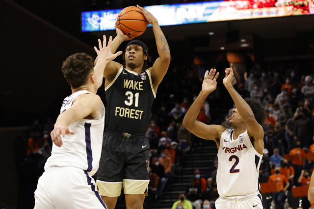Wake Forest guard Alondes Williams shoots the ball as Virginia center Francisco Caffaro defends.