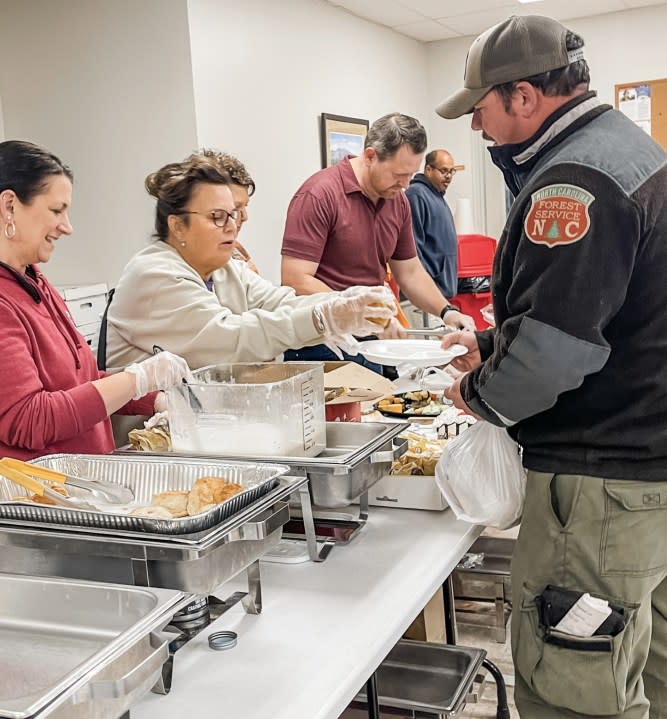 Chad Tucker, family serve Thanksgiving meals to firefighters at Sauratown Mountain