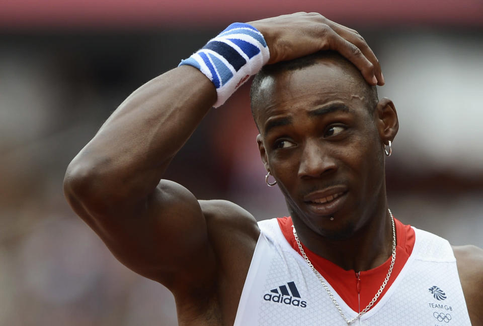 Britain's Phillips Idowu reacts after his jump in the men's triple jump qualification at the London 2012 Olympic Games at the Olympic Stadium August 7, 2012. REUTERS/Dylan Martinez (BRITAIN - Tags: OLYMPICS SPORT ATHLETICS) 