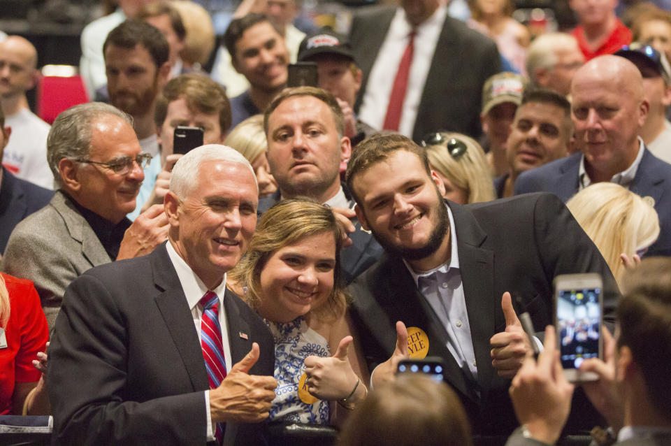 Vice President Mike Pence takes pictures with supporters during the Louisiana GOP Unity Rally in Kenner, La., Saturday, Oct. 5, 2019. Republicans are trying to keep Gov. John Bel Edwards, the Deep South's only Democratic governor, from topping 50% of the vote and gaining outright victory in the Oct. 12 primary. In Louisiana, candidates run on the same ballot regardless of party. (Sophia Germer/The Advocate via AP)