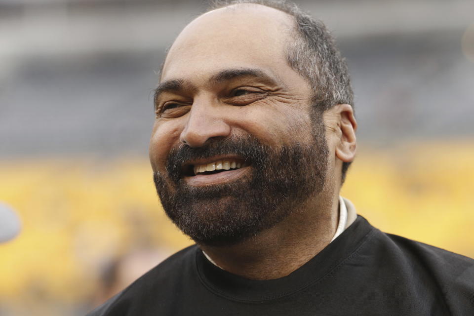 FILE - Former Pittsburgh Steelers pro football hall of fame running back Franco Harris takes part in festivities celebrating the 40th anniversary of the 1974 Steelers before an NFL football game between the Pittsburgh Steelers and the New Orleans Saints in Pittsburgh, Sunday, Nov. 30, 2014. Franco Harris, the Hall of Fame running back whose heads-up thinking authored “The Immaculate Reception,” considered the most iconic play in NFL history, died Wednesday, Dec. 21, 2022. He was 72. (AP Photo/Gene J. Puskar, File)