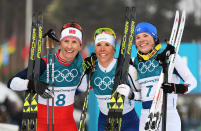 <p>Gold medalist Charlotte Kalla of Sweden (center) with silver medalist Marit Bjoergen of Norway (left), and bronze medalist Krista Parmakoski of Finland (right) pose after the Ladies Cross Country Skiing 7.5km + 7.5km Skiathlon . </p>