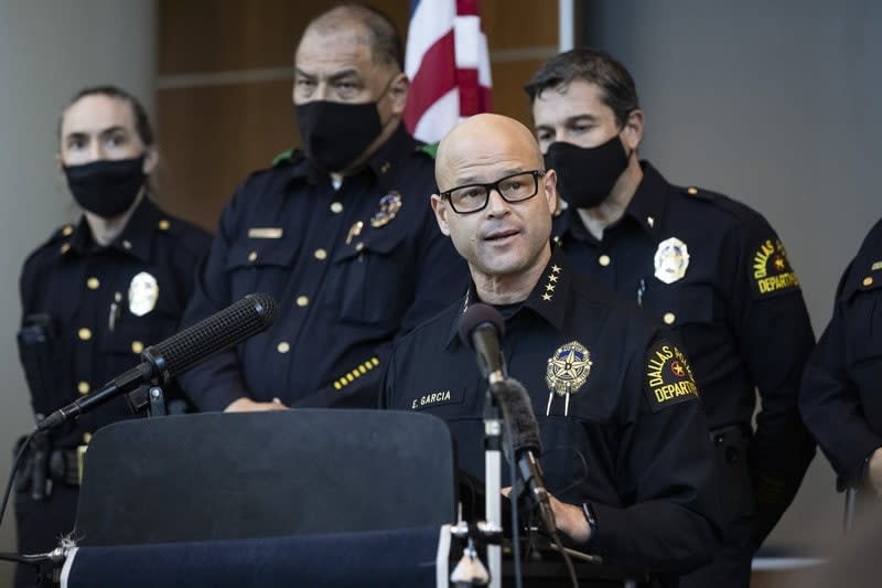 hief Eddie García, center, speaks with media during a press conference regarding the arrest and capital murder charges against Officer Bryan Riser at the Dallas Police Department headquarters on Thursday, March 4, 2021, in Dallas. (Lynda M. González/The Dallas Morning News via AP)