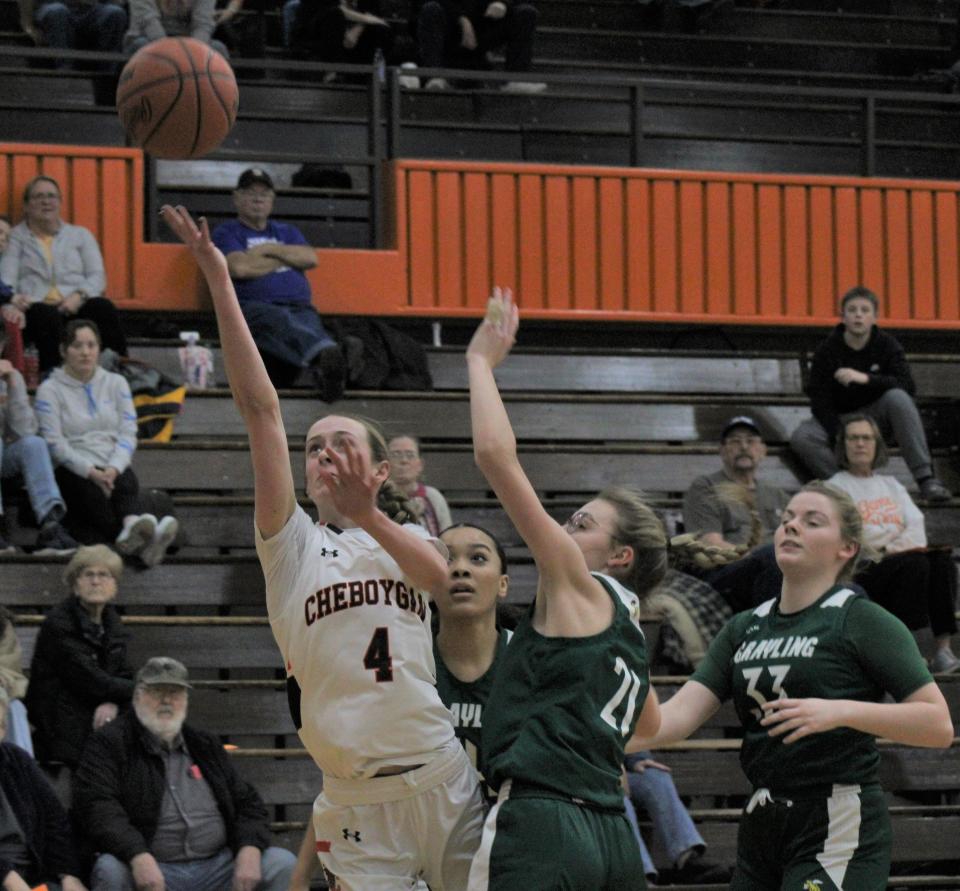 Cheboygan senior Bella Ecker (4) puts up a shot during the first half of Thursday's girls basketball home game against Grayling.