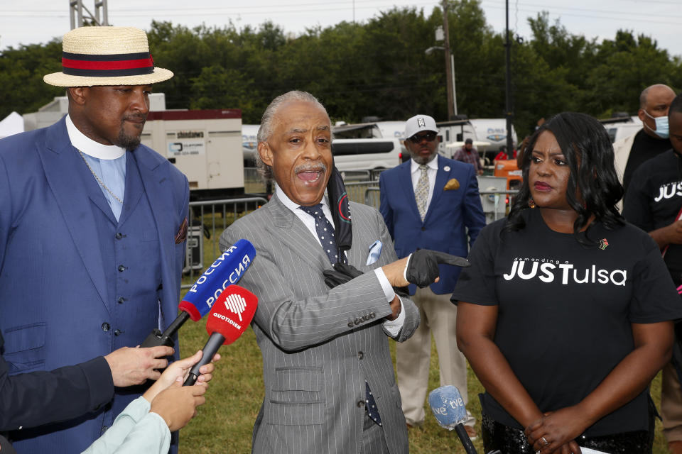 Rev. Al Sharpton, center, speaks at a news conference as Rev Robert Turner, left, and Tiffany Crutcher look on before a Juneteenth rally in Tulsa, Okla., Friday, June 19, 2020,. Juneteenth marks the day in 1865 when federal troops arrived in Galveston, Texas, to take control of the state and ensure all enslaved people be freed, more than two years after the Emancipation Proclamation. (AP Photo/Sue Ogrocki)