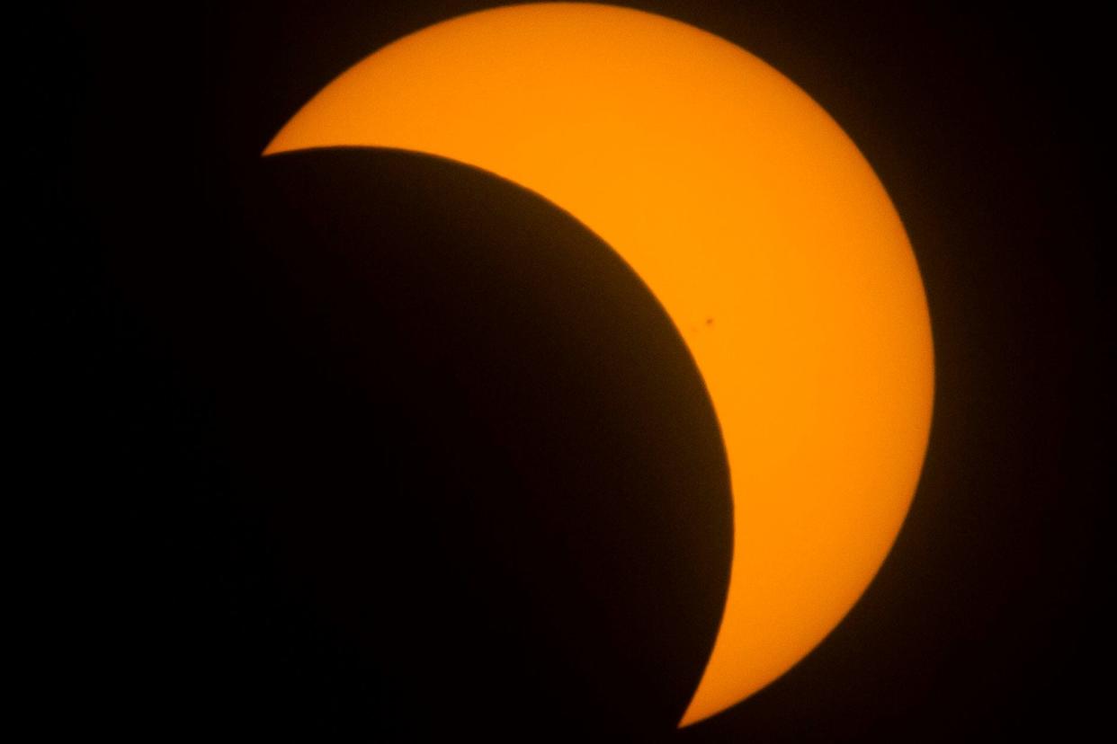 The moon eclipses the sun during the solar eclipse watch party at the downtown branch of the St. Joseph County Public Library in South Bend on Monday, Aug. 21, 2017.