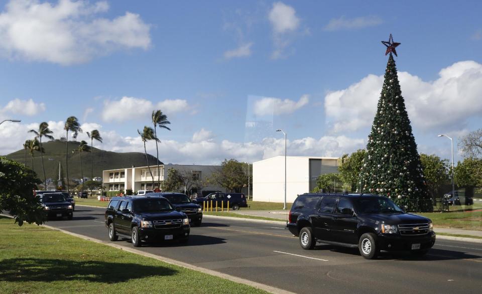 A motorcade with President Barack Obama aboard is seen from the media van as it drives from Marine Corps Base Hawaii, in Kaneohe Bay, Hawaii, Saturday, Dec. 17, 2016, after the president golfed at Kaneohe Klipper Golf Course on the base. (AP Photo/Carolyn Kaster)