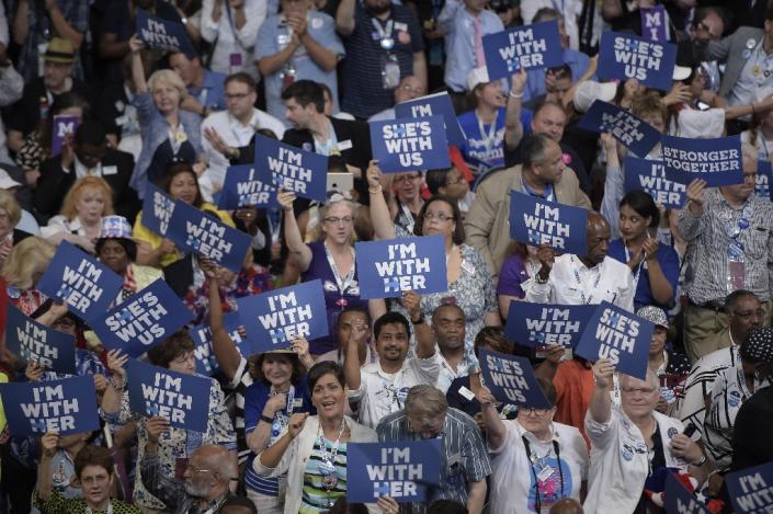 Delegates hold up signs in support of Hillary Clinton at the Democratic National Convention in Philadelphia, Pennsylvania (AFP Photo/Brendan Smialowski )