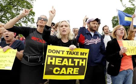 Demonstrators protest in front of the U.S. Capitol after the U.S. House of Representatives approved a bill on Thursday to repeal major parts of Obamacare and replace it with a Republican healthcare plan in Washington, U.S., May 4, 2017. REUTERS/Kevin Lamarque/Files