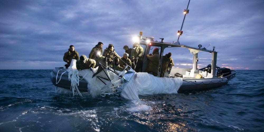 Sailors assigned to Explosive Ordnance Disposal Group 2 recover a high-altitude surveillance balloon off the coast of Myrtle Beach, South Carolina, Feb. 5, 2023.