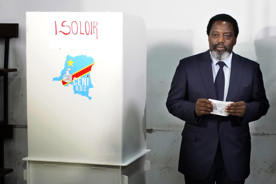 Congolese President Joseph Kabila casts his vote Sunday, Dec. 30, 2018 in Kinshasa, Congo. Forty million voters are registered for a presidential race plagued by years of delay and persistent rumors of lack of preparation. (AP Photo/Jerome Delay)