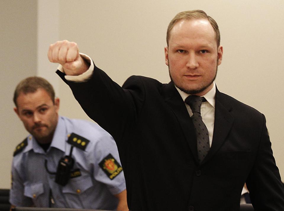 FILE - In this Aug. 24, 2012 file photo, mass murderer Anders Behring Breivik, makes a salute after arriving in the court room at a courthouse in Oslo. Breivik, who admitted killing 77 people in Norway last year, was declared sane and sentenced to prison for bomb and gun attacks. Convicted Norwegian mass-killer Breivik has threatened to go on hunger strike unless he gets access to better video games, a sofa and a larger gym. n a letter received by The Associated Press Tuesday Feb. 18, 2014, Breivik writes the hunger strike will continue until his demands are met or he dies. (AP Photo/Frank Augstein, File)