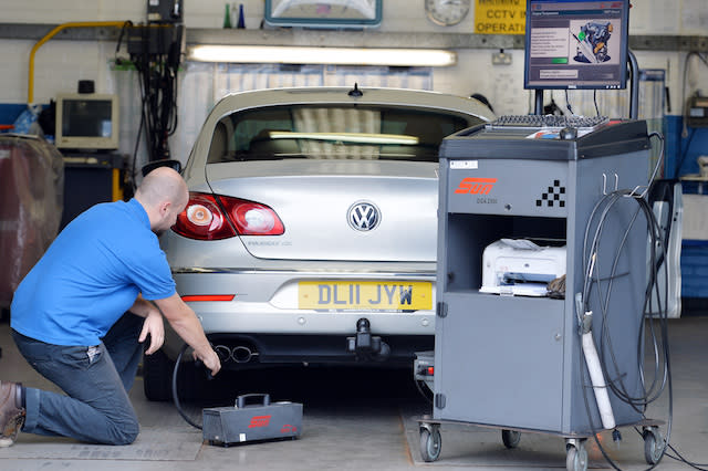 A Volkswagen Passat CC car is tested for its exhaust emissions, at a MOT (Ministry of Transport) testing station in Walthamstow, London, as the software used in Volkswagen's diesel cars to trick emissions testers in the US was also built into its European vehicles, according to Germany's transport minister.