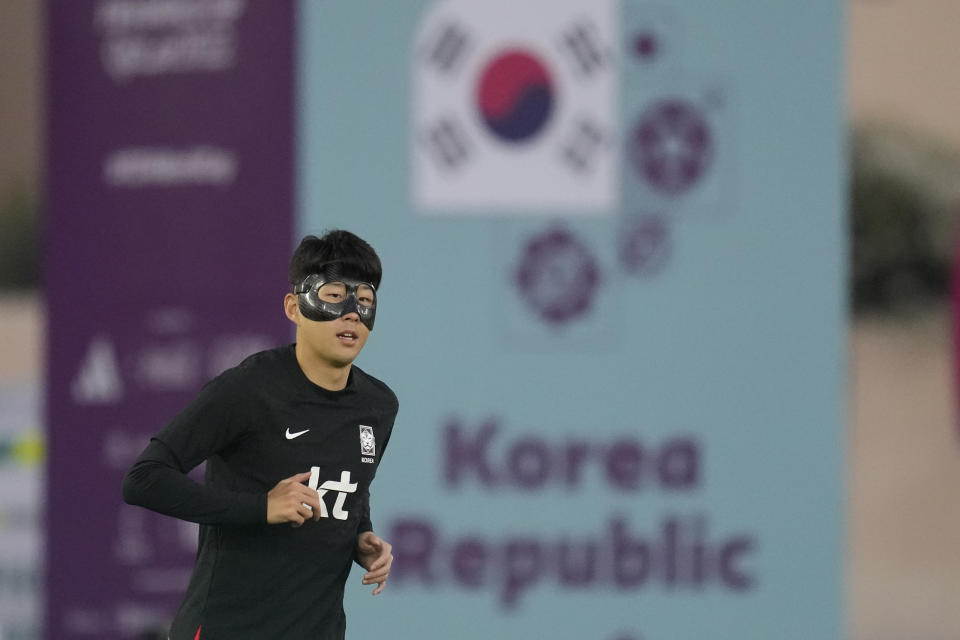 South Korea's Son Heung-min warms up during a training session at Al Egla Training Site 5 in Doha, Qatar, Tuesday, Nov. 22, 2022. South Korea will play its first match in Group H in the World Cup against Uruguay on Nov. 24. (AP Photo/Lee Jin-man)