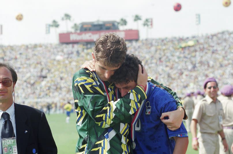 Brazil's goalie Taffarel consoles Italy's Roberto Baggio after the Brazilians won the World Cup with a 3-2 penalty shootout at the Rose Bowl in Pasadena, CA, 17 July 2024