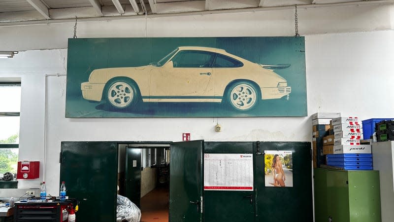 A faded photo of the original Ruf Yellowbird hangs over the hallway to the company's engine dynos.