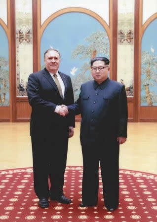 A U.S. government handout photo released by White House Press Secretary Sarah Huckabee Sanders shows U.S. Central Intelligence (CIA) Director Mike Pompeo meeting with North Korean leader Kim Jong Un in Pyongyang, North Korea in a photo that Sanders said was taken over Easter weekend 2018. U.S. Government via REUTERS