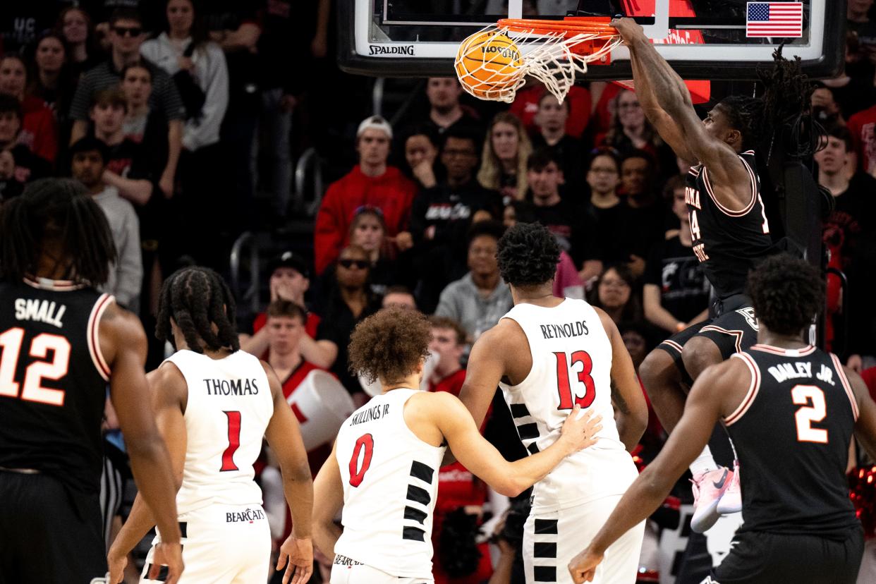 Oklahoma State Cowboys guard Jamyron Keller (14) dunks as they upset UC 80-76 Feb. 21 at Fifth Third Arena.