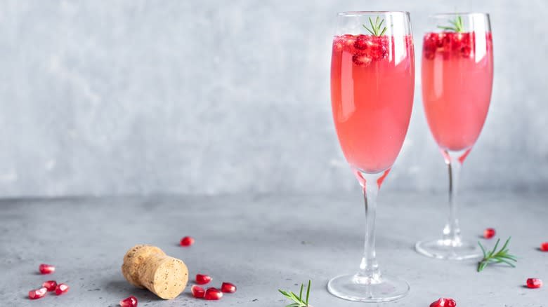 Two glasses of pomegranate mimosas 