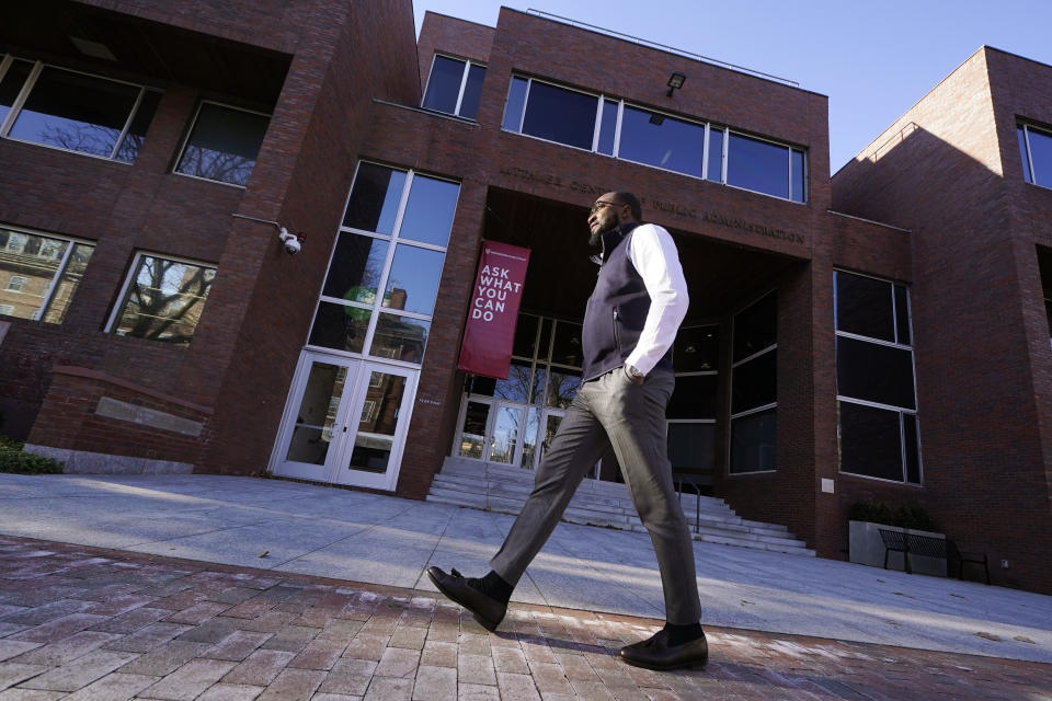 Quentin Fulks, who managed Sen. Raphael Warnock's re-election campaign in 2022, walks outside the John F. Kennedy School of Government at Harvard University, Thursday, Feb. 2, 2023, in Cambridge, Mass. Fulks decided in high school he wanted to work in politics. He had no obvious path but saw a model from nearby Plains: former President Jimmy Carter. Encouragement from a high school teacher who is Carter’s niece helped, too. (AP Photo/Charles Krupa)
