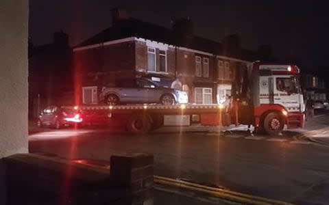 The silver Astra being taken away - Credit: MEN Media/Hull Daily Mail