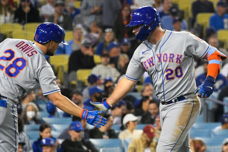 New York Mets' J.D. Davis, left, congratulates Pete Alonso on his home run against the Los Angeles Dodgers during the seventh inning of a baseball game Friday, June 3, 2022, in Los Angeles.