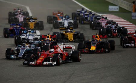 Formula One - F1 - Bahrain Grand Prix - Sakhir, Bahrain - 16/04/17 - Ferrari Formula One driver Sebastian Vettel of Germany leads the pack during the race. REUTERS/Hamad I Mohammed