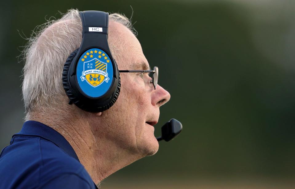 St. Ignatius football coach Chuck Kyle watches his men on the field during the first half of a high school football game against the Archbishop Hoban Knights, Friday, Sept. 16, 2022, in Akron, Ohio.