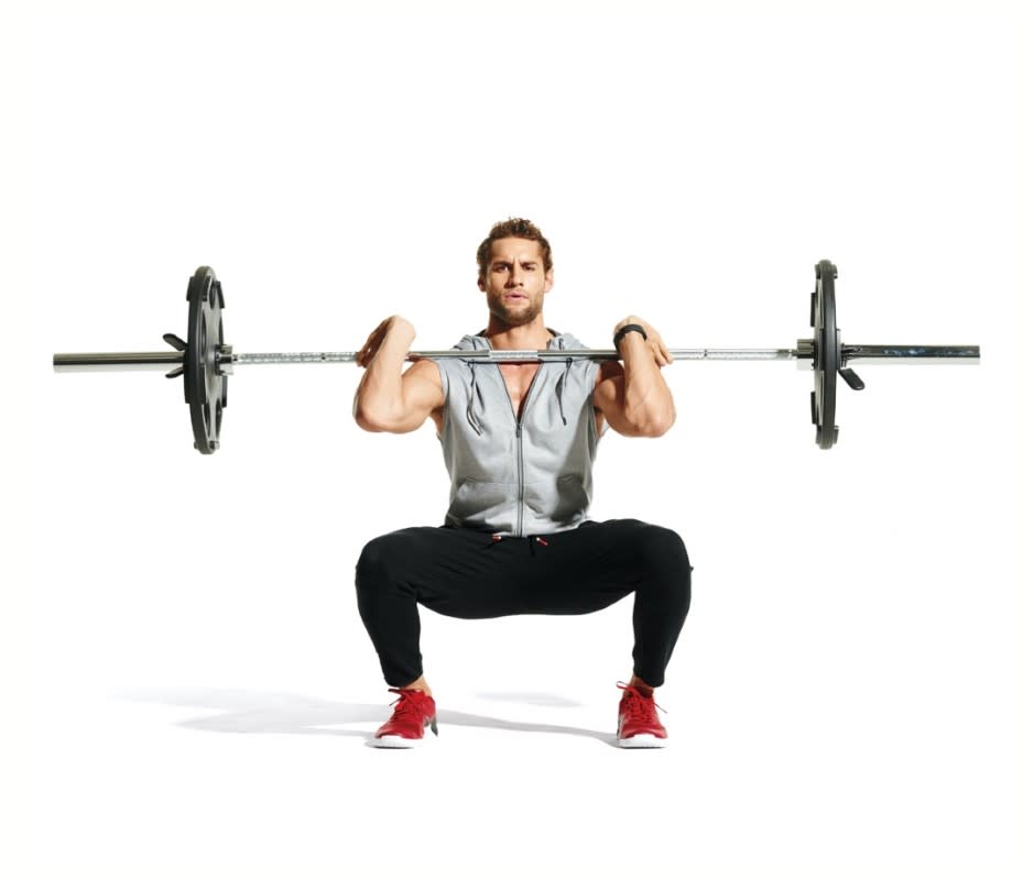 <p>James Michelfelder</p>How to Do It<ol><li>Set a barbell on a power rack at about shoulder height, to start. </li><li>Grasp the bar with hands shoulder-width apart and raise your elbows until your upper arms are parallel to the floor. </li><li>Take the bar out of the rack and let it rest on your fingertips. Step back and set your feet shoulder-width apart with your toes turned out slightly. Squat as low as you can without losing the arch in your low back.</li><li>That's 1 rep. Perform 5 x 5 reps, working up to the heaviest weight you can handle with proper form.</li></ol>Pro Tip<p>Throughout the entire movement keep your back straight and chest open to ensure you aren’t leaning too far forward. </p>