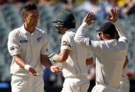 New Zealand's Trent Boult (L) celebrates with team mates after dismissing Australia's Joe Burns (C) LBW for 11 runs during the third day of the third cricket test match at the Adelaide Oval, in South Australia, November 29, 2015. REUTERS/David Gray