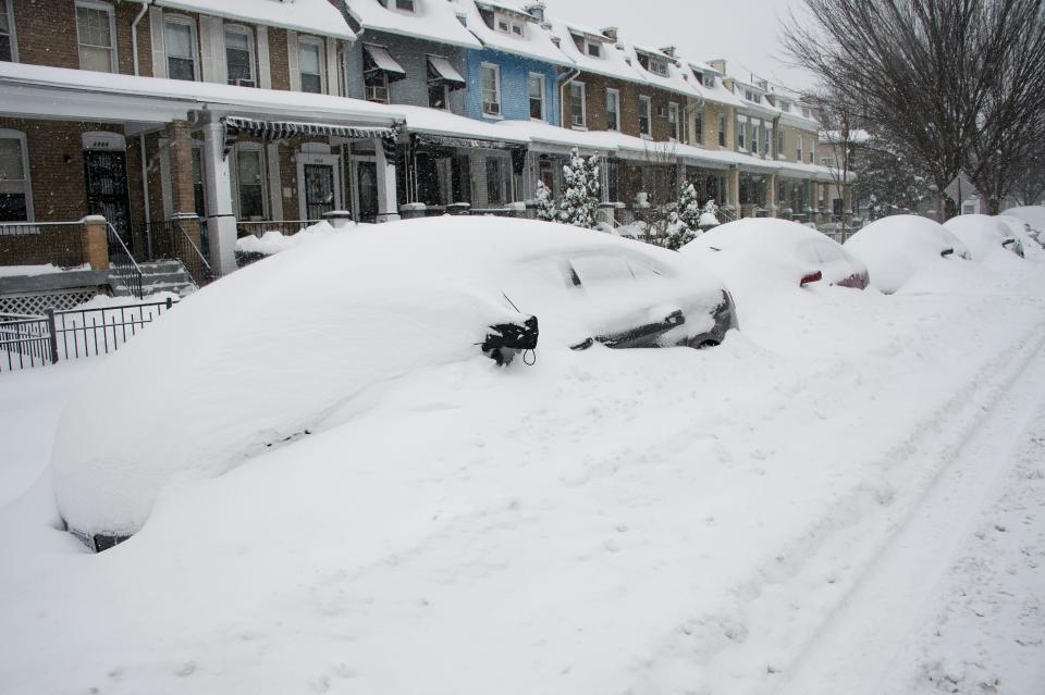 Parked cars are snowed in during a snowstorm in Washington, DC, on January 23, 2016. A deadly blizzard with bone-chilling winds and potentially record-breaking snowfall slammed the eastern US on January 23, as officials urged millions in the storm's path to seek shelter -- warning the worst is yet to come. US news reports said at least eight people had died by late Friday from causes related to the monster snowstorm, which is expected to last until early Sunday.&nbsp;